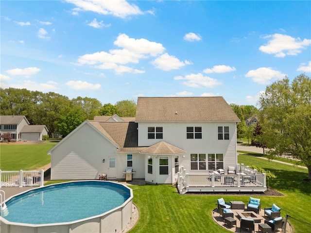 1030 Whistlers Cove Ln, Greece, NY 14612 - rear view of property featuring a wooden deck, an outdoor living space with a fire pit, an outdoor pool, a lawn, and roof with shingles