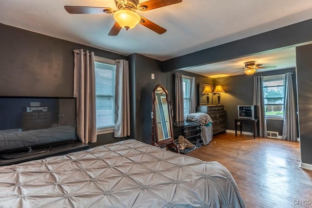 906 Beley Ave, Salina, NY 13211 - bedroom with wood finished floors, baseboards, a ceiling fan, and beamed ceiling
