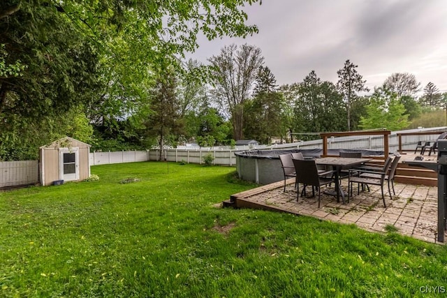 906 Beley Ave, Salina, NY 13211 - view of yard featuring view of wooded area, a patio area, and outdoor dining space