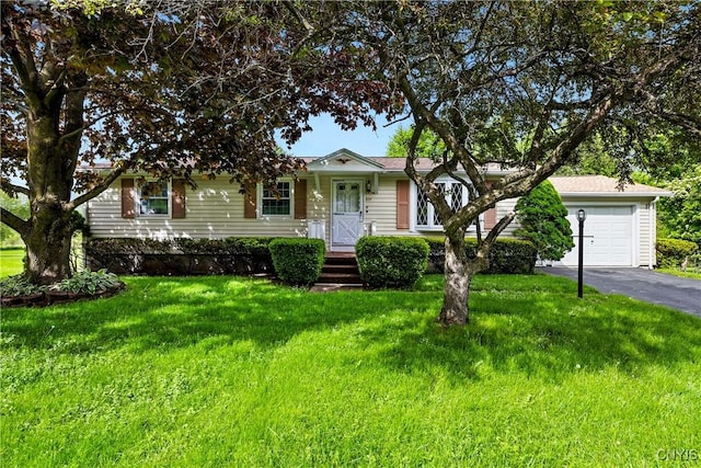 829 Franklin St, Skaneateles, NY 13152 - view of front of house with asphalt driveway, a front yard, and an attached garage
