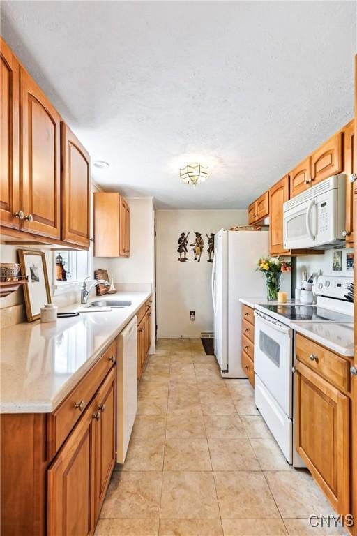 829 Franklin St, Skaneateles, NY 13152 - kitchen featuring white appliances, a sink, light countertops, and brown cabinetry