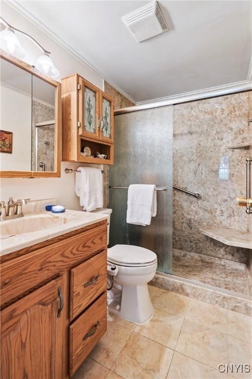 829 Franklin St, Skaneateles, NY 13152 - full bathroom with vanity, toilet, a shower stall, ornamental molding, and tile patterned flooring