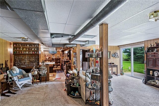 829 Franklin St, Skaneateles, NY 13152 - basement featuring a drop ceiling, carpet, and wood walls