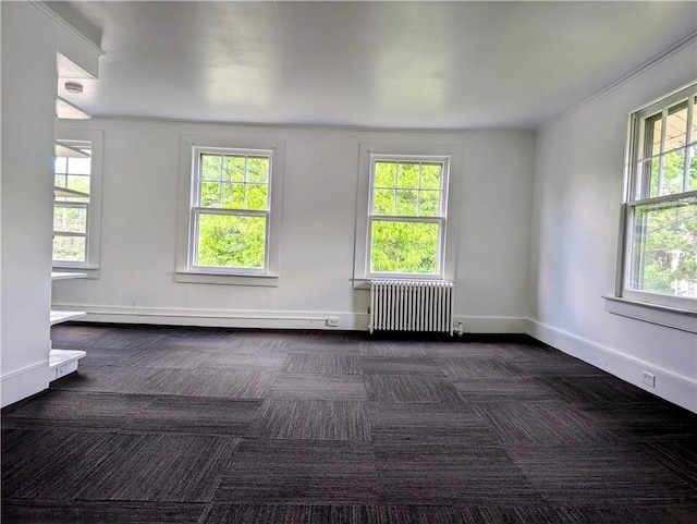706 E Washington Ave, Elmira-City, NY 14901 - empty room featuring radiator, dark carpet, a baseboard heating unit, and healthy amount of natural light