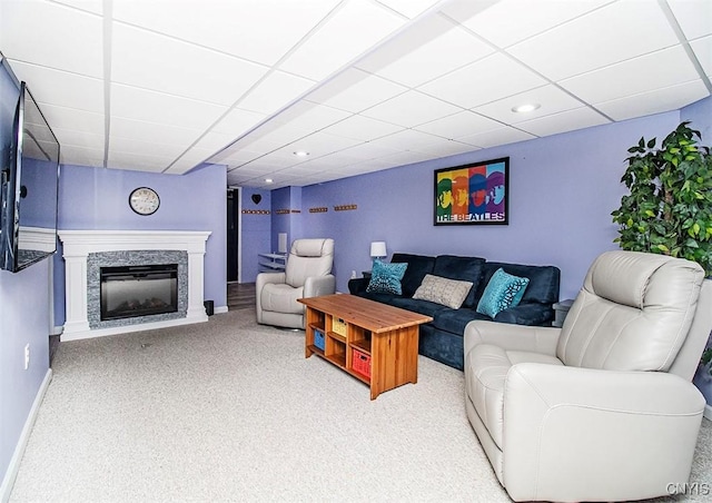 106 Peterson Dr, Camillus, NY 13031 - carpeted living area featuring a paneled ceiling, a fireplace, recessed lighting, and baseboards
