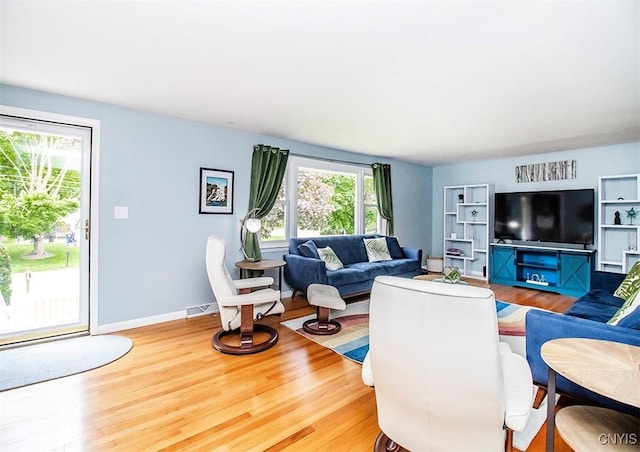 106 Peterson Dr, Camillus, NY 13031 - living area with healthy amount of natural light and wood finished floors