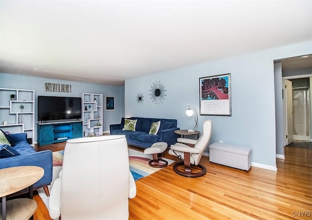 106 Peterson Dr, Camillus, NY 13031 - living area featuring wood finished floors and baseboards
