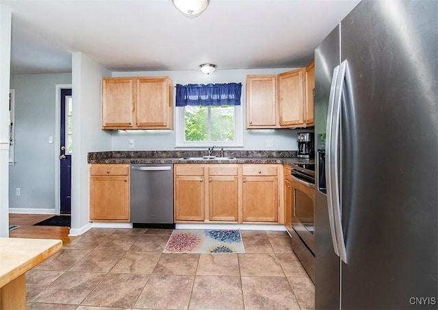 106 Peterson Dr, Camillus, NY 13031 - kitchen featuring appliances with stainless steel finishes, a sink, light brown cabinetry, and light tile patterned floors