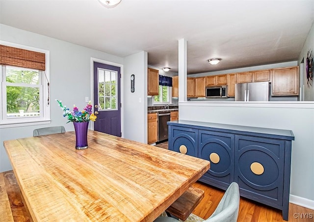 106 Peterson Dr, Camillus, NY 13031 - dining space featuring light wood-style floors and baseboards