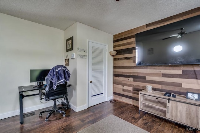 44191 Lime St, Wilna, NY 13665 - office space featuring wooden walls, dark wood-style flooring, a textured ceiling, baseboards, and a ceiling fan