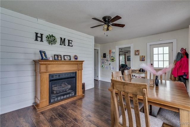 44191 Lime St, Wilna, NY 13665 - dining space with a ceiling fan, dark wood finished floors, a fireplace, and baseboards