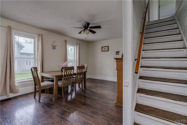 44191 Lime St, Wilna, NY 13665 - dining room with stairs, ceiling fan, dark wood-type flooring, and baseboards