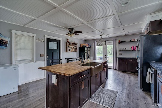 44191 Lime St, Wilna, NY 13665 - kitchen with wood finished floors, wooden counters, refrigerator, a sink, and wainscoting