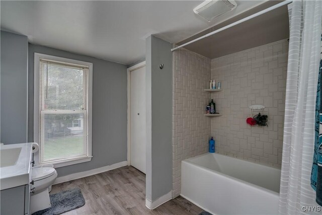 44191 Lime St, Wilna, NY 13665 - full bath featuring shower / tub combo, vanity, toilet, wood finished floors, and baseboards