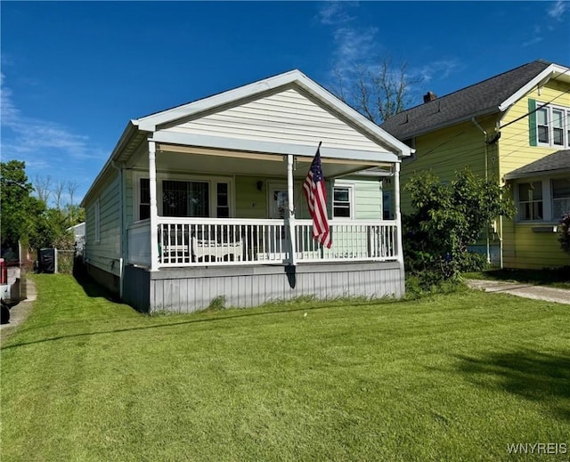 815 91st St, Niagara Falls, NY 14304 - view of front of house featuring a porch and a front lawn