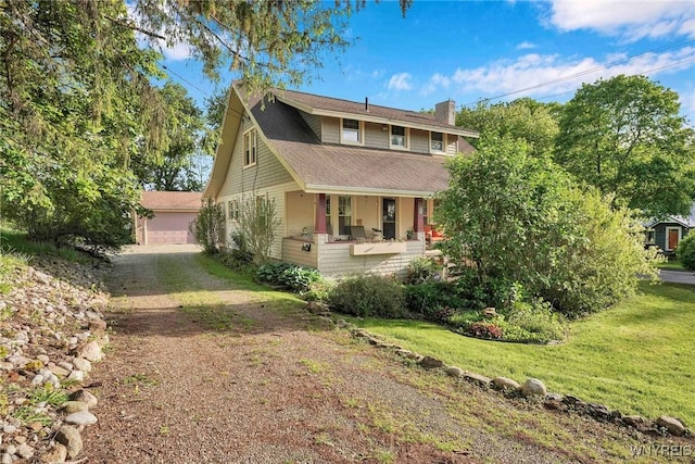 52 Jackson St, Warsaw, NY 14569 - view of front of home featuring covered porch, a chimney, a front lawn, and an outdoor structure