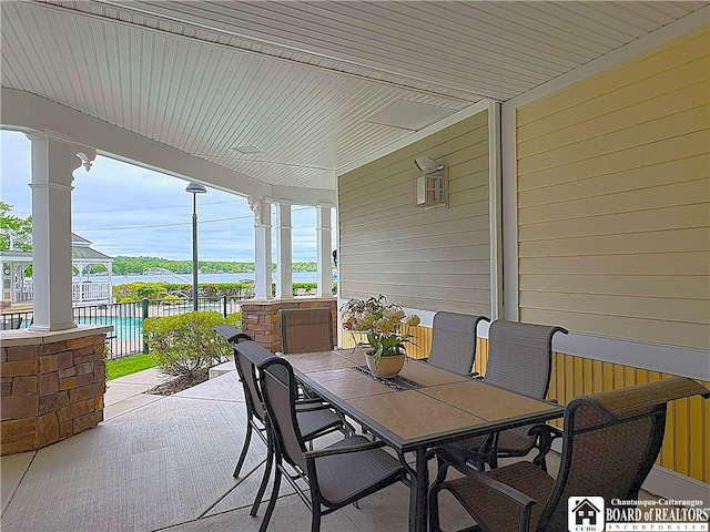 50 Lakeside Dr Unit C103, Ellery, NY 14712 - view of patio / terrace featuring a water view and outdoor dining space