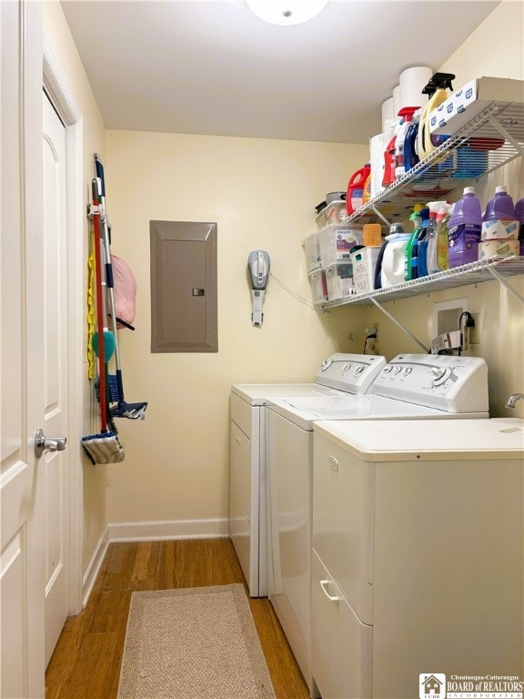 50 Lakeside Dr Unit C103, Ellery, NY 14712 - laundry area with electric panel, washing machine and clothes dryer, light wood-style flooring, and baseboards