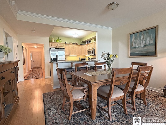 50 Lakeside Dr Unit C103, Ellery, NY 14712 - dining room featuring crown molding, light wood-style flooring, and baseboards
