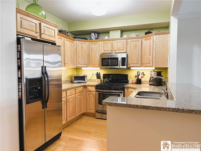 50 Lakeside Dr Unit C103, Ellery, NY 14712 - kitchen featuring stainless steel appliances, a sink, light brown cabinetry, and light wood-style floors