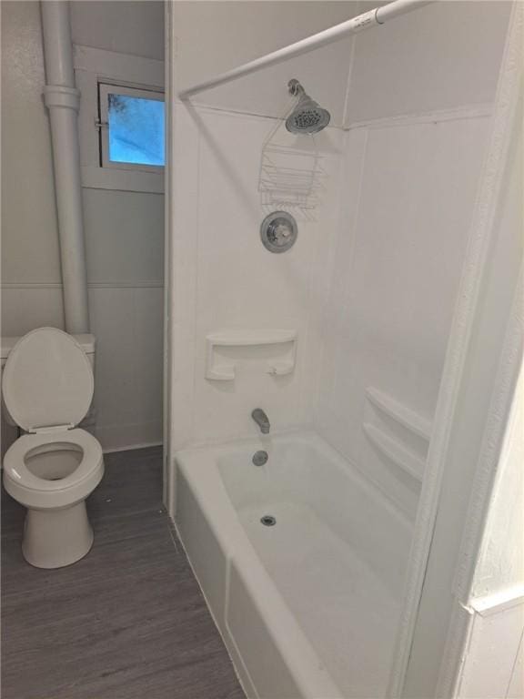 307 W Hudson St, Elmira-City, NY 14904 - bathroom featuring toilet, wood finished floors, and shower / bath combo with shower curtain