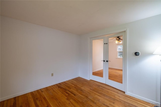 7634 Anne Ter, Clay, NY 13212 - spare room featuring french doors, light wood-style flooring, and baseboards