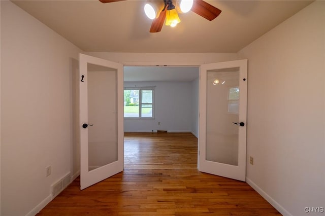 7634 Anne Ter, Clay, NY 13212 - hall with french doors, wood finished floors, and baseboards
