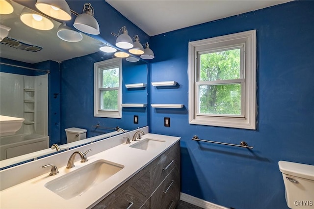 7634 Anne Ter, Clay, NY 13212 - bathroom with toilet, double vanity, and baseboards