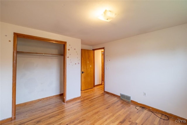 7634 Anne Ter, Clay, NY 13212 - unfurnished bedroom with light wood finished floors, a closet, and baseboards