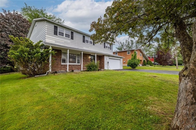 7634 Anne Ter, Clay, NY 13212 - traditional home with brick siding, asphalt driveway, and a front yard