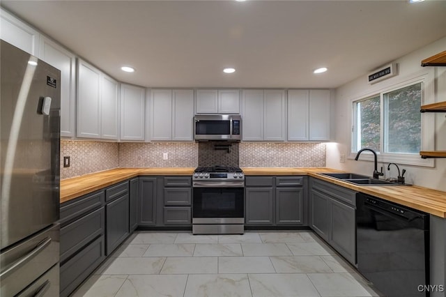 7634 Anne Ter, Clay, NY 13212 - kitchen with stainless steel appliances, wood counters, a sink, gray cabinets, and recessed lighting
