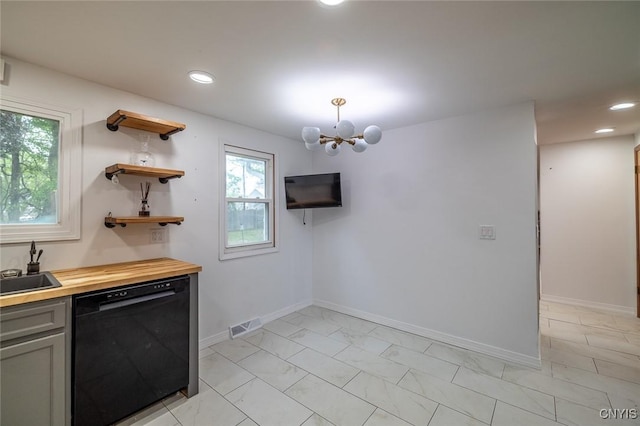 7634 Anne Ter, Clay, NY 13212 - kitchen featuring dishwasher, butcher block counters, a chandelier, recessed lighting, and baseboards