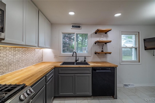 7634 Anne Ter, Clay, NY 13212 - kitchen featuring black dishwasher, butcher block counters, a sink, gray cabinets, and backsplash
