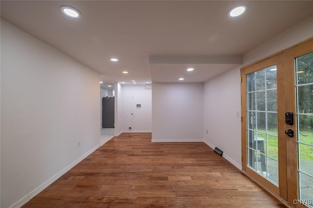 7634 Anne Ter, Clay, NY 13212 - hall with recessed lighting, wood finished floors, baseboards, healthy amount of natural light, and french doors