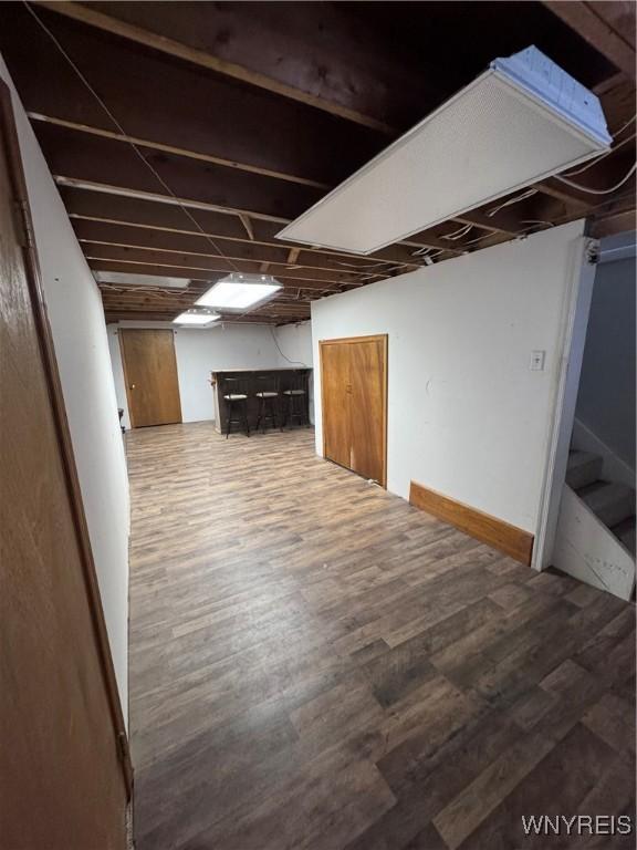 9357 Steffi Dr, Evans, NY 14006 - finished basement featuring a dry bar, wood finished floors, and stairs