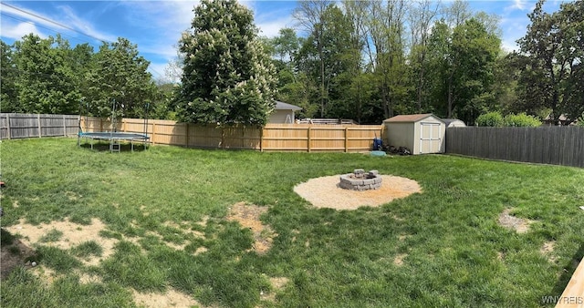 9357 Steffi Dr, Evans, NY 14006 - view of yard with a trampoline and a fire pit