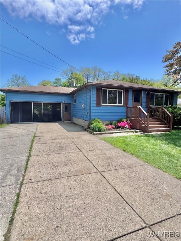9357 Steffi Dr, Evans, NY 14006 - ranch-style house featuring a front lawn and concrete driveway