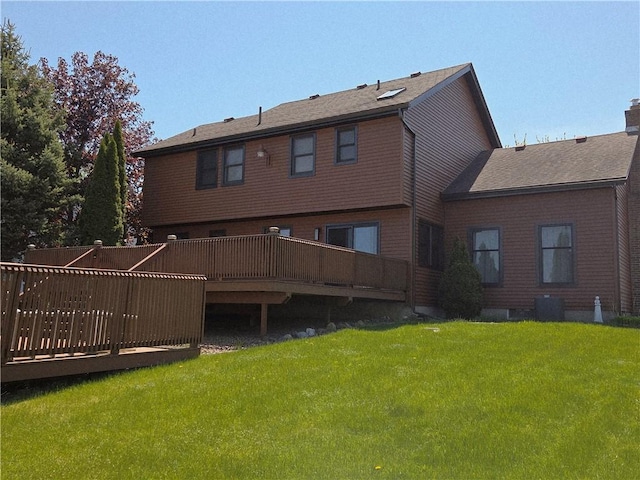 70 Crestway Ln, Greece, NY 14612 - back of property featuring a deck, a yard, and central AC