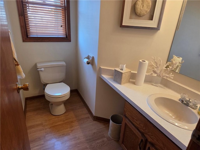 70 Crestway Ln, Greece, NY 14612 - bathroom featuring toilet, vanity, baseboards, and wood finished floors
