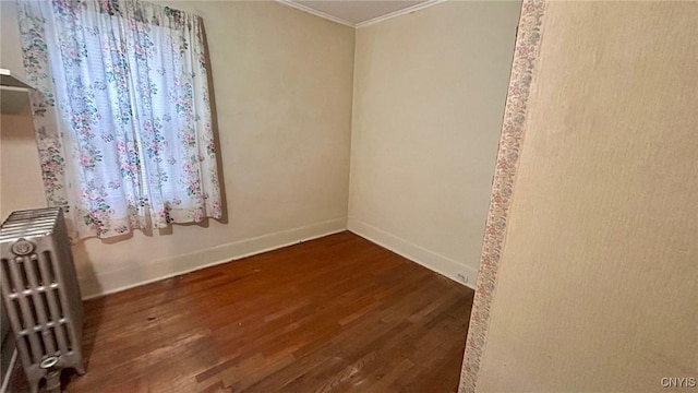 318 Boyden St, Syracuse, NY 13203 - empty room featuring radiator, crown molding, wood finished floors, and baseboards
