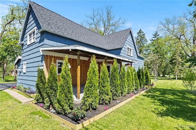 5302 William St, Lancaster, NY 14086 - view of property exterior with a shingled roof and a yard