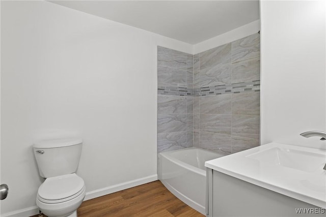 5302 William St, Lancaster, NY 14086 - bathroom featuring wood finished floors, baseboards, toilet, and vanity