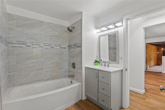 5302 William St, Lancaster, NY 14086 - bathroom with wood finished floors, bathtub / shower combination, and vanity