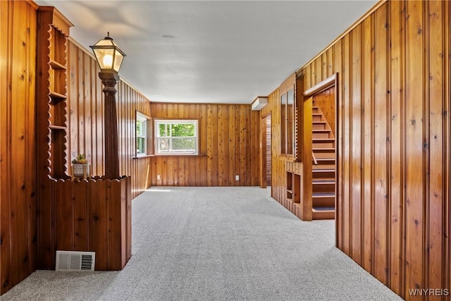 5302 William St, Lancaster, NY 14086 - unfurnished room with carpet floors, stairs, and wood walls