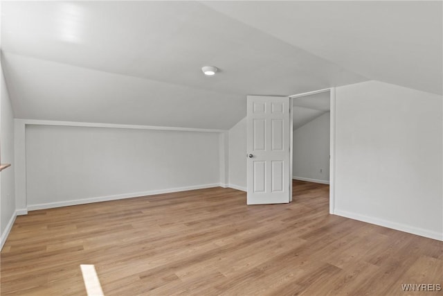 5302 William St, Lancaster, NY 14086 - bonus room with lofted ceiling, light wood-style flooring, and baseboards