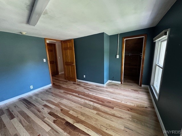 21 Maple St, Evans, NY 14006 - spare room with light wood-style flooring and baseboards