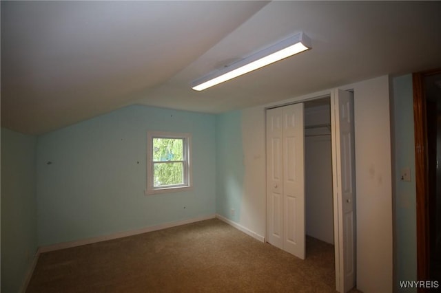 21 Maple St, Evans, NY 14006 - unfurnished bedroom featuring a closet, carpet flooring, and lofted ceiling