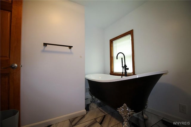 21 Maple St, Evans, NY 14006 - full bathroom with a freestanding bath and baseboards