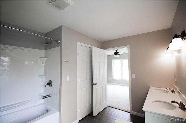 21 Maple St, Evans, NY 14006 - full bathroom with shower / bathtub combination, wood finished floors, double vanity, and a ceiling fan