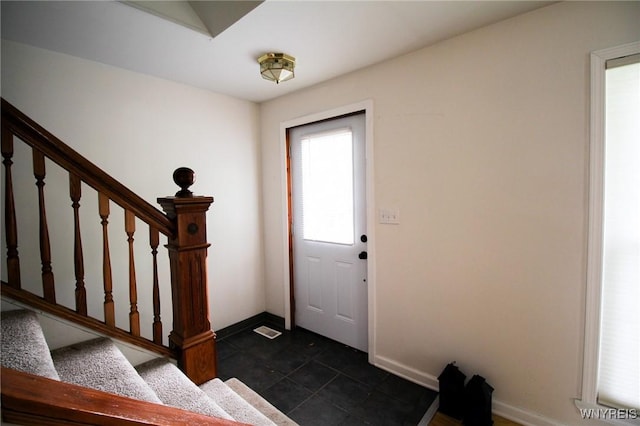 21 Maple St, Evans, NY 14006 - entryway with stairs and dark tile patterned floors